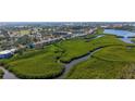 Scenic aerial view showcasing the condo community with stunning water and mangrove views at 1106 Bird Bay Way # 316, Venice, FL 34285