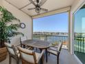 Relax on the balcony with a table and chairs and take in the scenic water views at 501 Tamiami N Trl # 502, Venice, FL 34285