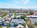 Expansive aerial view of the home and neighborhood, highlighting the property's prime location near the water at 605 Cornwell On The Gulf, Venice, FL 34285