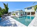 Inviting backyard pool and patio area, perfect for outdoor entertaining and relaxation at 605 Cornwell On The Gulf, Venice, FL 34285