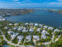 Beautiful aerial view of the home and neighborhood with water views at 746 Eagle Point Dr, Venice, FL 34285