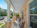 Inviting front porch with comfortable seating, perfect for enjoying the outdoors at 12468 Shimmering Oak Cir, Venice, FL 34293