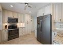 Bright kitchen with white cabinets, granite countertops, stainless steel appliances, and modern design at 225 Randolph Rd, Venice, FL 34293