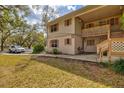 Charming two-story condo featuring neutral siding, shutters and a well-maintained lawn at 1051 Forrest Nelson Blvd # A-103, Port Charlotte, FL 33952