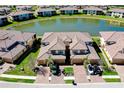 Aerial view of community with pond at 20181 Ragazza Cir # 101, Venice, FL 34293