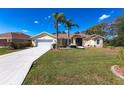A charming single-story home with manicured lawn and landscaping at 255 San Cristobal Ave, Punta Gorda, FL 33983