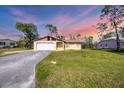 Beautiful single-story house featuring a wide lawn and concrete driveway at 3716 Dunbar Rd, Venice, FL 34293