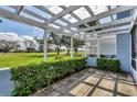 Outdoor patio with a green view and a white lattice fence at 454 Cerromar Rd # 172, Venice, FL 34293