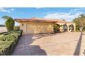 Charming Mediterranean-style home featuring a terra cotta tile roof and attached two-car garage at 6427 Canary St, Sarasota, FL 34241