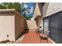 Brick patio with outdoor seating and storage shed next to the lanai at 726 Bird Bay Cir # 46, Venice, FL 34285