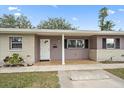 Inviting home entrance with a tiled porch and a neatly painted front door with sidelight at 1703 Bal Harbour Dr # 2, Venice, FL 34293