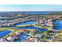 Expansive aerial view of a community with a series of lakes and neatly planned streets at 217 Savona Way, North Venice, FL 34275