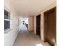 Well-maintained hallway featuring elevator access at 232 Saint Augustine Ave # 207, Venice, FL 34285