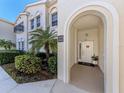Inviting entryway with arched entrance, unit number and decorative touches at 2602 Ravinia Cir # 2602, Venice, FL 34292
