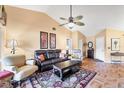 Spacious living room with tile flooring, high ceilings, and neutral paint and decor at 311 Pembroke Dr # 217, Venice, FL 34293