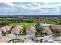 Beautiful golf course community with ponds and nature preserves, as seen from an aerial view at 4301 Whispering Oaks Dr, North Port, FL 34287