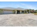 A generously sized driveway and multi-car garage offering ample parking space at 771 Stewart St, Englewood, FL 34223