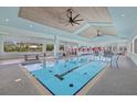 Indoor pool and recreation area with gym and ping pong table at 14 Grouper Hole Dr, Boca Grande, FL 33921