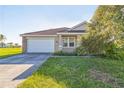 Charming single-story home featuring a two-car garage, well maintained lawn and tile roof at 17370 Cape Horn Blvd, Punta Gorda, FL 33955
