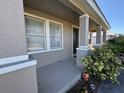 Inviting front porch featuring a neutral color palette and manicured landscaping at 17370 Cape Horn Blvd, Punta Gorda, FL 33955