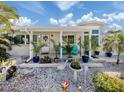 Inviting front porch with seating, plants, and decorative accents, creating a cozy outdoor space at 229 San Marco Dr, Venice, FL 34285