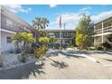 Landscaped courtyard featuring tropical plants, providing a serene and inviting space for residents of the condo community at 236 Harbor S Dr # 202, Venice, FL 34285