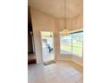 Bright breakfast nook with tiled floor featuring a bay window and patio access at 244 Willowick Way, Venice, FL 34293