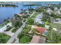 An aerial view of the property showing the home's position within the community and proximity to the bay at 302 Bayview Pkwy, Nokomis, FL 34275