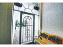 A decorative security gate and a bench at the entryway of this home at 4398 Summertree Rd, Venice, FL 34293