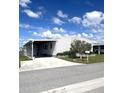Charming single-story home featuring a carport, landscaped yard, and meticulous, low maintenance curb appeal at 495 Schooner St, North Port, FL 34287