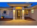 Inviting front entrance featuring decorative glass door and manicured landscaping at 632 Valencia Rd, Venice, FL 34285
