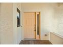 Front door with sidelight offering natural light and providing secure entry to the residence at 718 Golden Beach Blvd # 2, Venice, FL 34285
