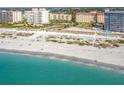 Beautiful beach view, showcasing the oceanfront condos, sandy beach, and inviting blue water at 830 The Esplanade N # 201, Venice, FL 34285