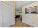 Inviting hallway with tile floors and artwork, leading to the main living area at 9407 Prospect Ave, Englewood, FL 34224