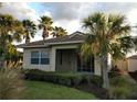 View of the covered lanai with a lush tropical view at 102 Mestre Ct, North Venice, FL 34275