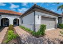Attractive single-story home with brick driveway and well-maintained landscaping at 11810 Tapestry Ln, Venice, FL 34293