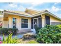 Charming home featuring a tile roof and meticulously landscaped front yard at 1330 Berkshire Ct, Venice, FL 34292