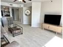 Bright living room with tile floors and open floor plan at 1401 S Mccall Rd # 106, Englewood, FL 34223