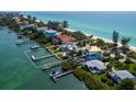 Waterfront property with dock and boat lift provides direct access to the Gulf at 1604 Casey Key Rd, Nokomis, FL 34275