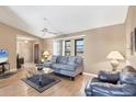Inviting living room with ample natural light, plush seating, and stylish decor, perfect for relaxation at 221 Mark Twain Ln, Rotonda West, FL 33947