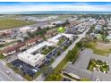 Aerial view of the condo complex near commercial airport and neighboring streets at 400 Base E Ave # 213, Venice, FL 34285