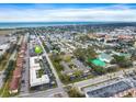 Wide aerial shot of the condo complex near a residential neighborhood and the ocean at 400 Base E Ave # 213, Venice, FL 34285