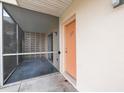 Close up of ground floor condo patio and exterior wall at 400 Base E Ave # 213, Venice, FL 34285