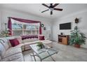 Inviting living room with lots of natural light, neutral walls, tile floors, and a glass coffee table at 4802 51St W St # 1816, Bradenton, FL 34210