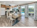 Eat-in kitchen area with modern finishes and a beautiful chandelier at 601 Apalachicola Rd, Venice, FL 34285