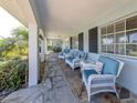 Inviting front porch with comfortable seating and stylish decor at 601 Apalachicola Rd, Venice, FL 34285