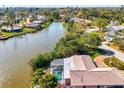 Beautiful waterfront home featuring a screened in pool at 6146 Rockefeller Ave, Sarasota, FL 34231