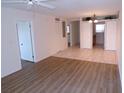 Living room with tiled dining area and views into the kitchen and other rooms at 649 S Tamiami S Trl # 304, Venice, FL 34285