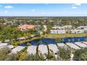 A view from above of the property next to a body of water within a community at 902 Tartan Dr # 29, Venice, FL 34293