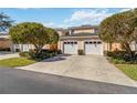 Charming two-story home featuring a two-car garage and mature landscaping at 903 Gondola Park Dr # 903, Venice, FL 34292
